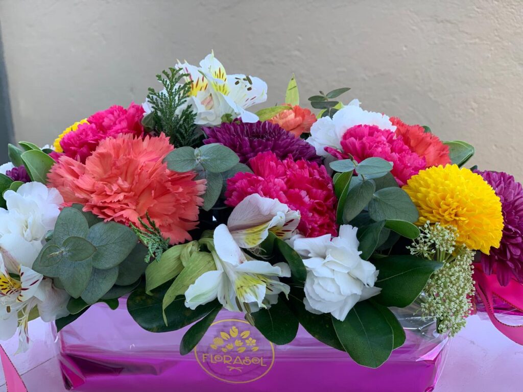 Red and pink mixed flower bouquet with fresh greenery