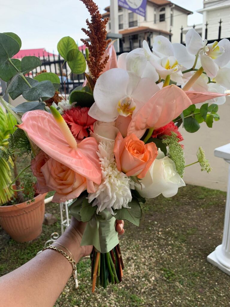 Colorful bouquet featuring sunflowers, orange and purple flowersery
